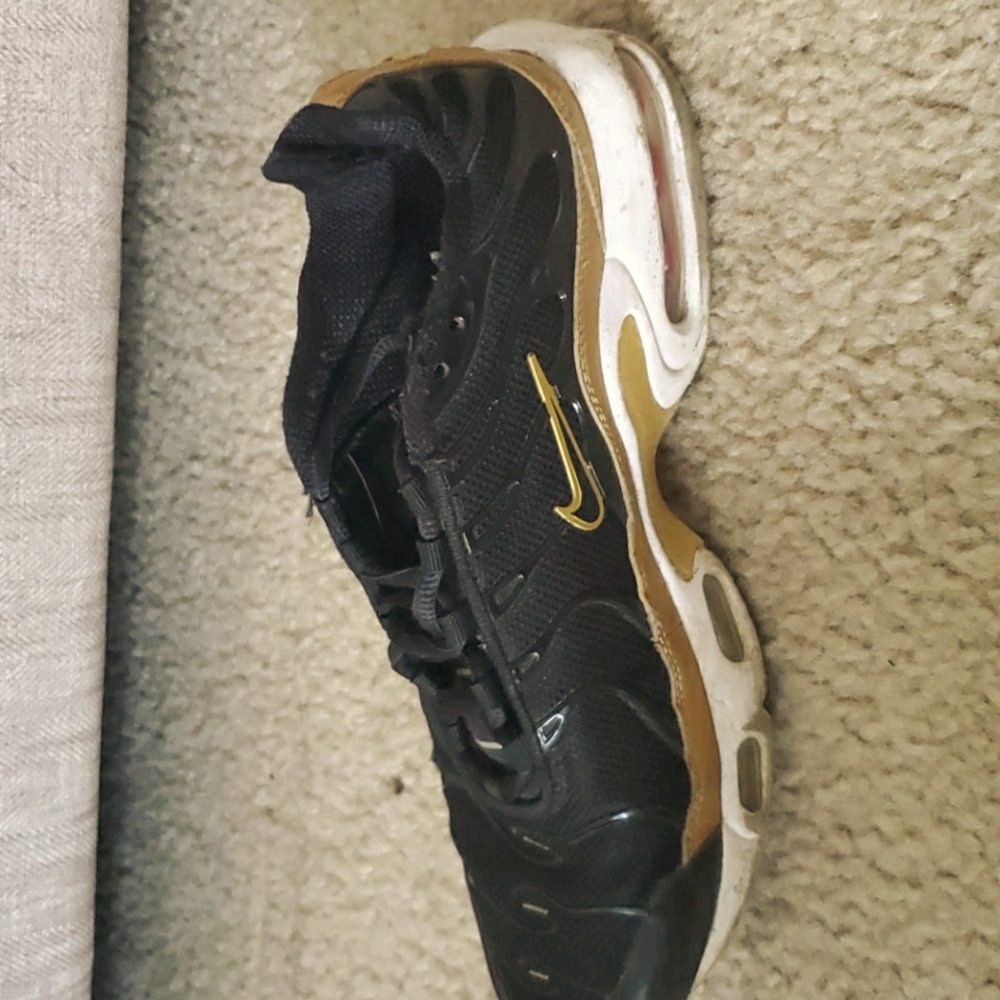 Black and gold  Nike sneakers